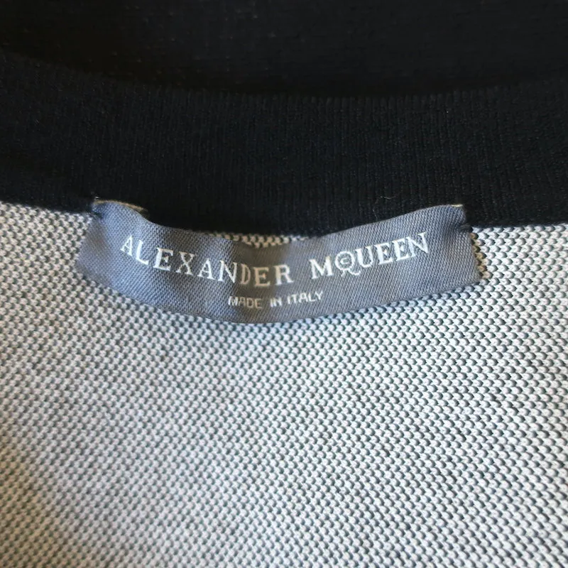 Alexander McQueen Haut à péplum en jacquard imprimé serpent noir Taille S