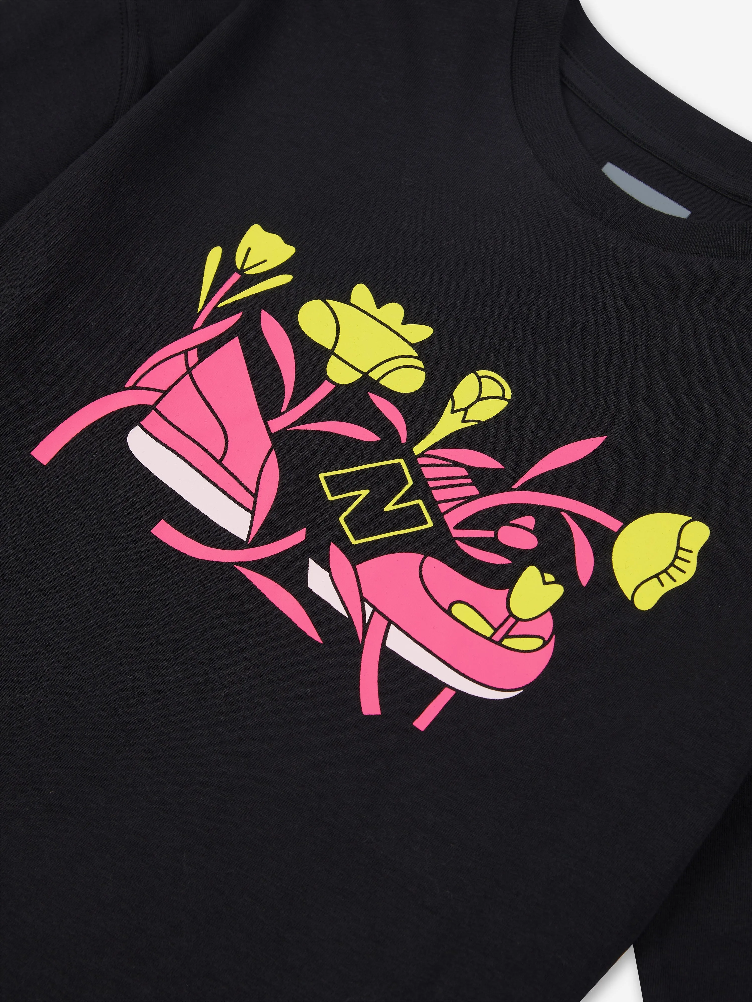 T-shirt graphique New Balance pour filles à motif floral en noir
