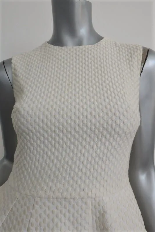 Pierre Balmain Haut sans manches péplum crème pois brodé coton taille 38