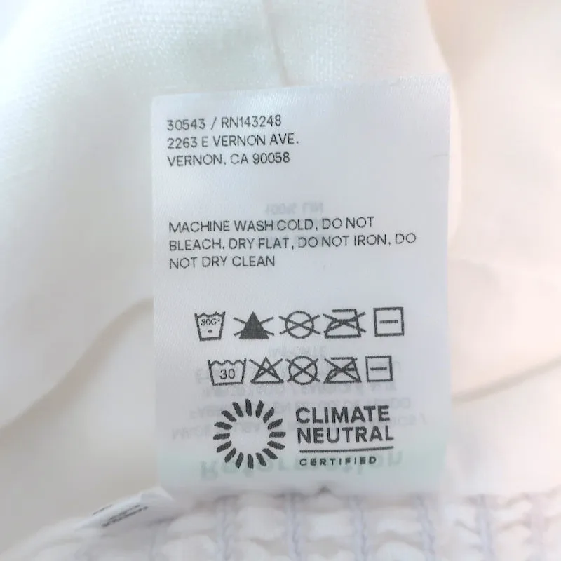 Haut court à manches bouffantes Reformation en lin blanc Taille 0