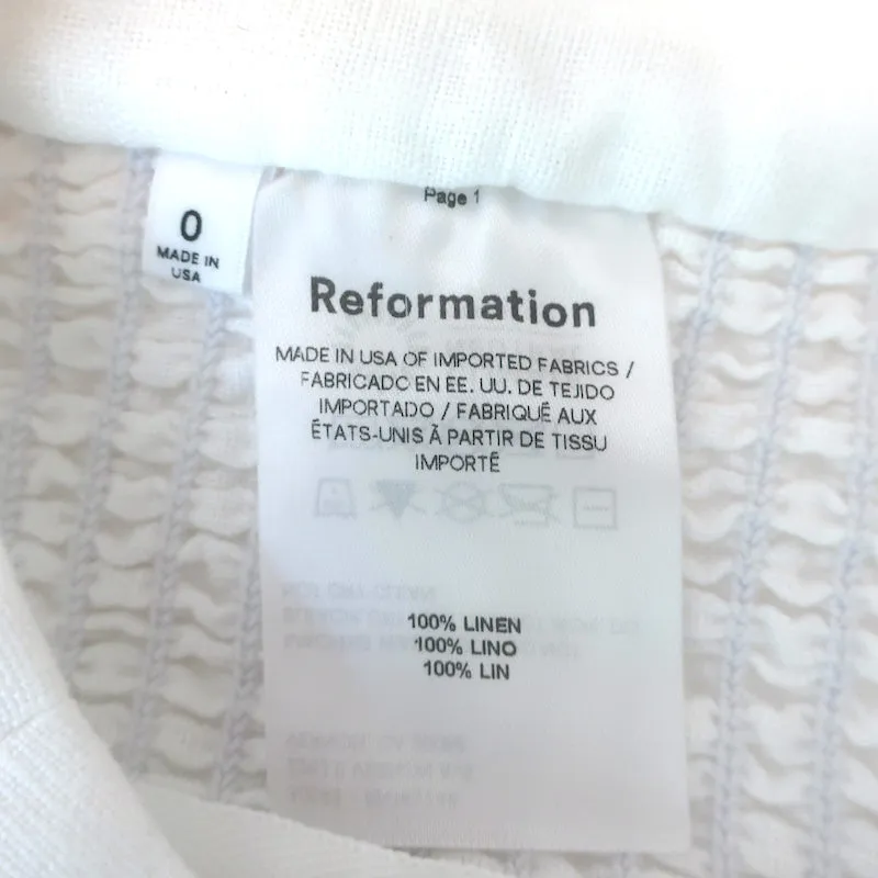 Haut court à manches bouffantes Reformation en lin blanc Taille 0